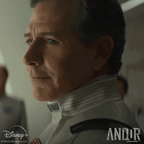 a close up of a man 's face with andor star wars written on the bottom
