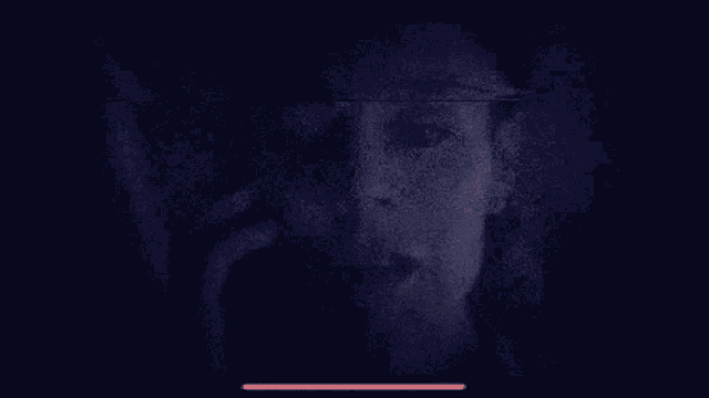 a blurry picture of a man 's face with the words `` wheresemil '' written in red on the bottom .