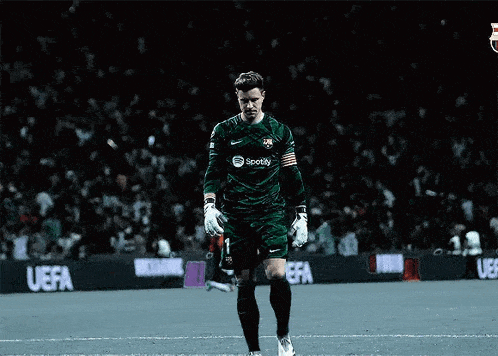 a soccer player with a spotify logo on his jersey