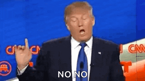 donald trump is wearing a suit and tie and giving the middle finger .