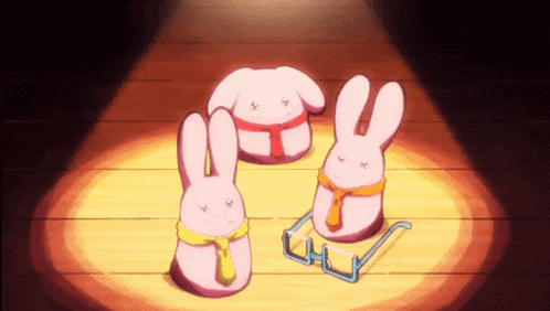 three pink rabbits wearing glasses and ties are sitting on a wooden floor under a spotlight