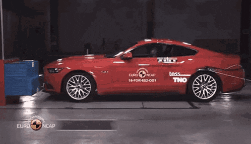 a red car with euroncap written on the side
