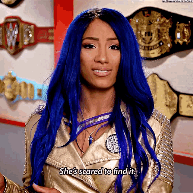 a woman with blue hair says she 's scared to find it while wearing a gold jacket
