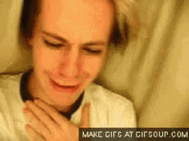 a close up of a person crying with a make gifs at gifsoup.com watermark