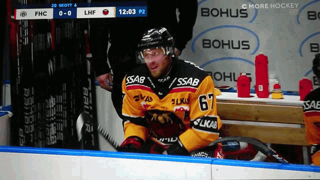 a hockey player wearing a jersey with the number 67 on it
