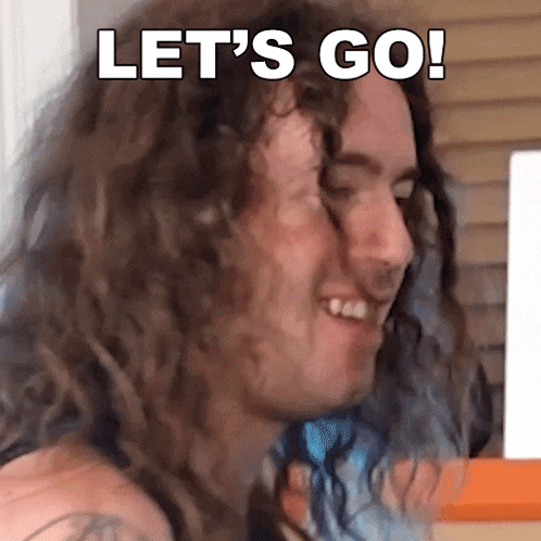 a man with long curly hair is smiling with the words let 's go below him