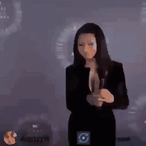a woman in a black dress is being interviewed by a man