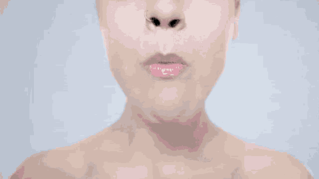 a woman has a large eye in her mouth .