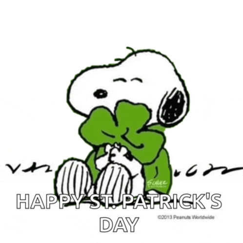a cartoon of snoopy wearing a green scarf and a green bow tie .