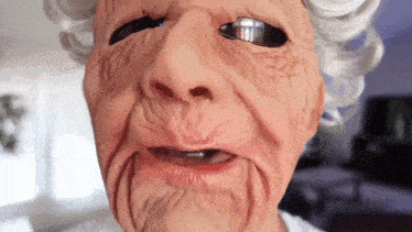 a close up of a woman 's face with a mask on