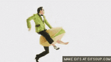 a man in a green suit is riding on the back of a hamburger