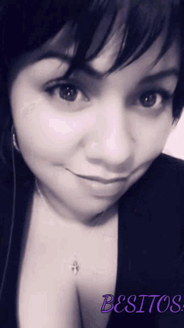 a black and white photo of a woman with the words besitos on the bottom right