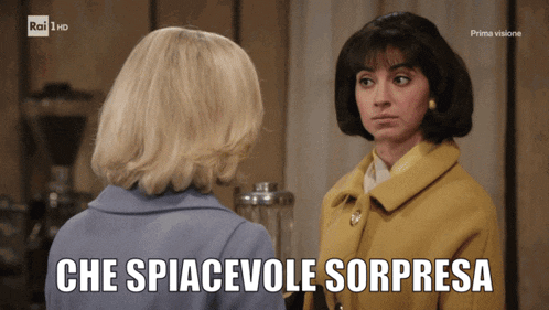 two women are standing next to each other with the caption che spacevole sorpresa
