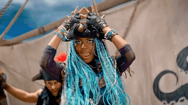 a woman with blue braids is wearing a pirate costume