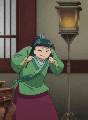 a girl in a green shirt and purple skirt is standing in front of a lamp post