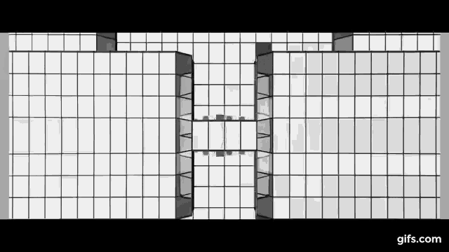 a black and white photo of a large building with lots of windows .