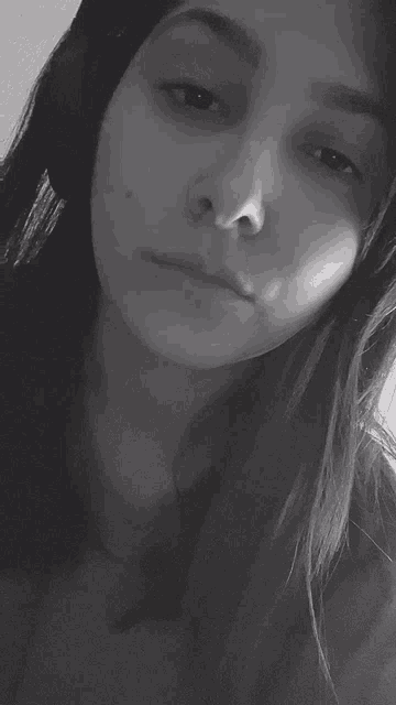 a black and white photo of a woman without makeup