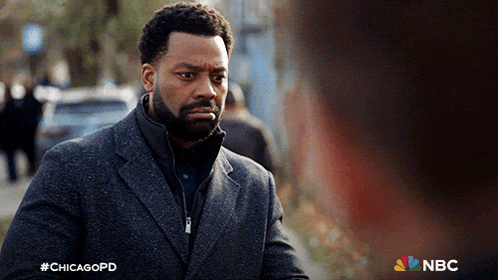 a man with a beard is walking down a street with the hashtag #chicagopd on the bottom