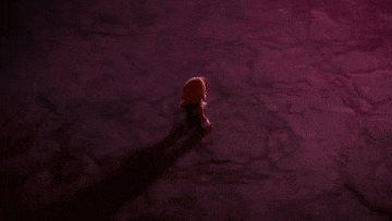 a person is standing in a dark room with a shadow on the floor .