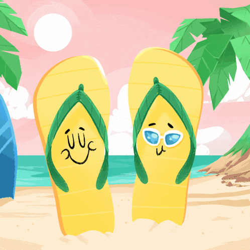 a pair of flip flops with faces drawn on them are on a beach