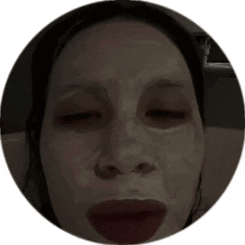 a woman is wearing a mask on her face .