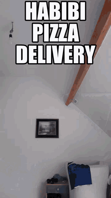 a bedroom with a picture on the wall and the words habibi pizza delivery above it