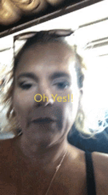 a woman 's face is shown with the words oh yes on the bottom right