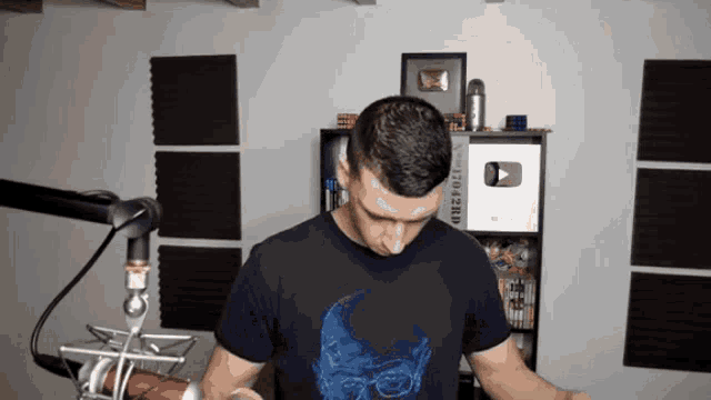 a man wearing a shirt that says breaking bad on it