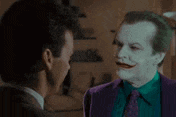 a man in a purple suit is talking to another man and says i like him already .