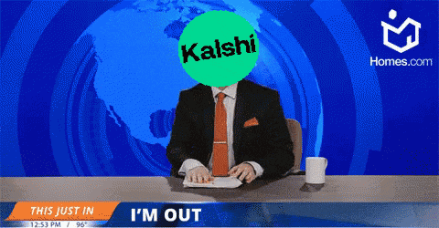 a man in a suit and tie is sitting at a desk with a kaishi logo in front of him