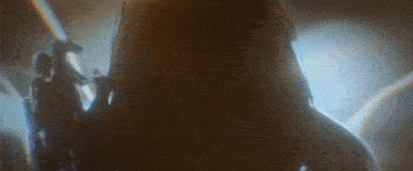 a close up of a person 's head with a light shining on it .
