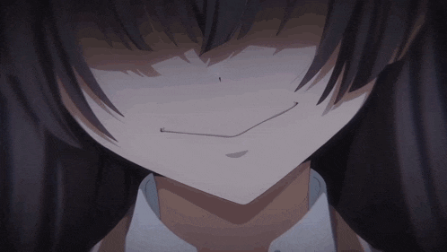 a close up of a girl 's face with dark hair