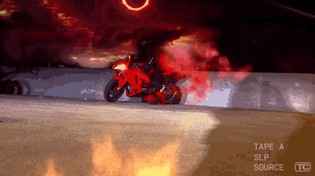 a red motorcycle is on fire with tape a slp source tc visible