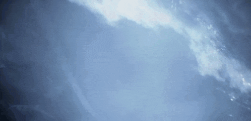 the sun is shining through the clouds on a blue background .