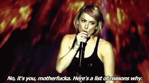 a woman singing into a microphone with the words no it 's you motherfucka here 's a list of reason why