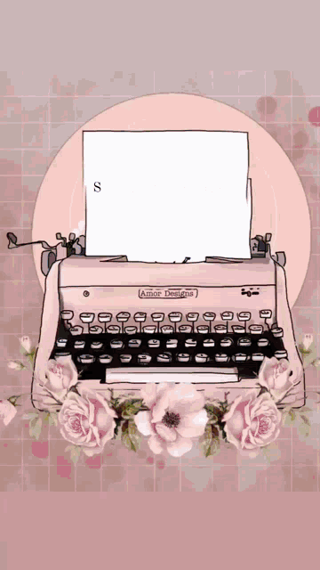 a pink amor designs typewriter with pink flowers around it