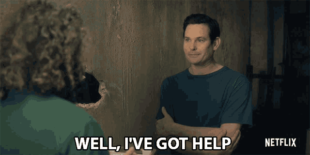 a man says well i 've got help in front of a netflix logo
