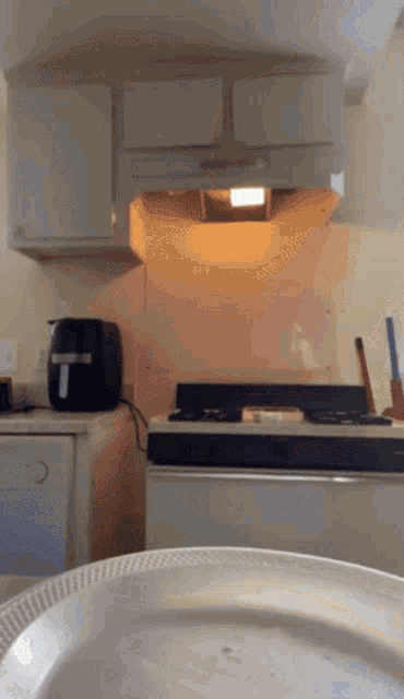 a kitchen with a toaster and a plate