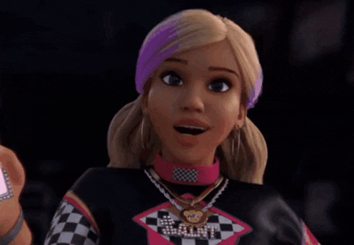 a barbie doll is holding a cell phone and looking at it .