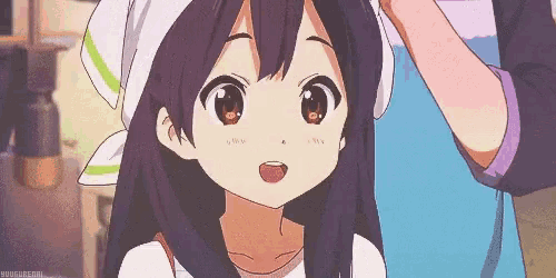 a girl with long purple hair is wearing an apron and a bandana on her head .