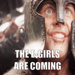a man wearing a helmet with the words the e-girls are coming