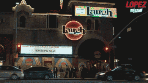 a building with a sign that says laugh