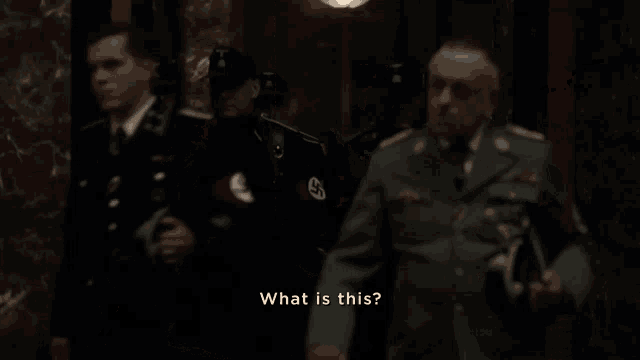 a man in a military uniform says " what is this " in front of a group of soldiers