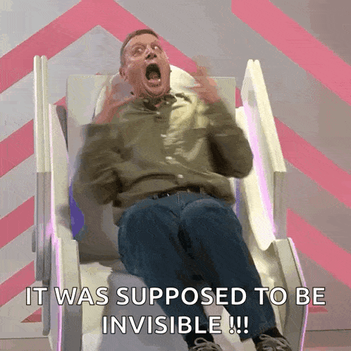 a man is sitting in a chair with his mouth open and the words it was supposed to be invisible written below him