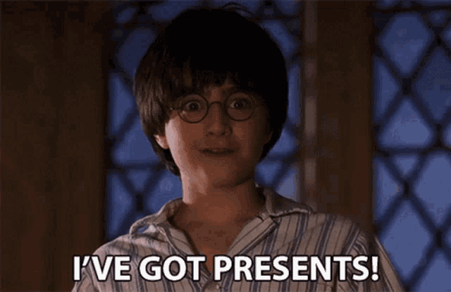 harry potter says i 've got presents in front of a window