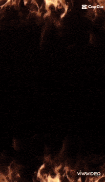a person 's face is surrounded by flames on a black screen