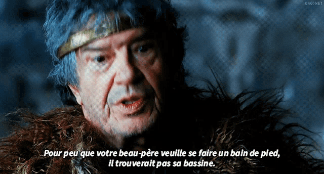 a man with blue hair and a beard says pour peu que votre beau-père veuille se faire un bain de pied