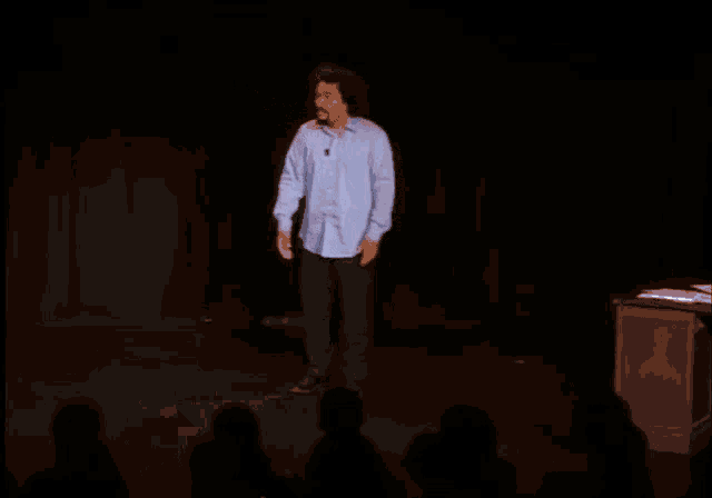 a man on stage with the words tu vas la prendre celle-la written on the bottom