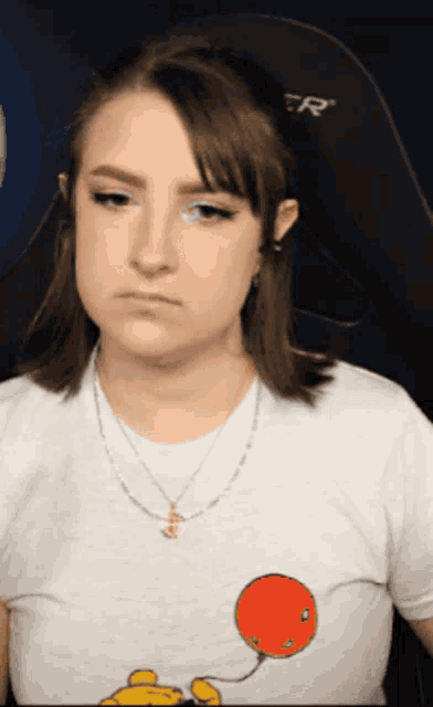 a woman is wearing a shirt with a balloon on it