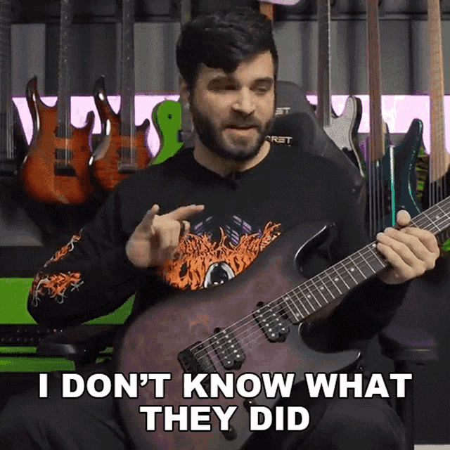 a man playing a guitar with the words " i don 't know what they did " on the bottom